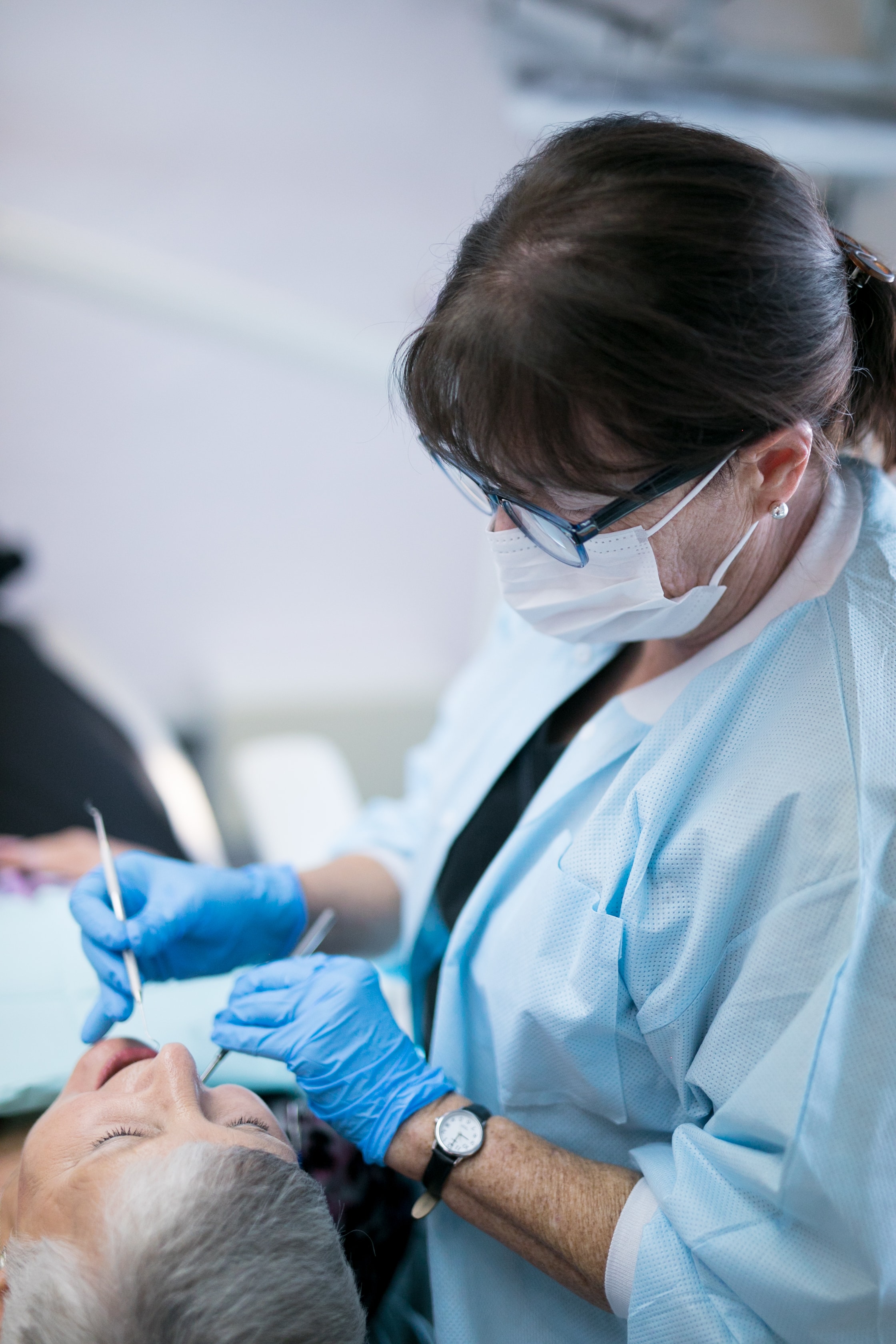 Dental hygienist providing preventive care at Maycer Dental